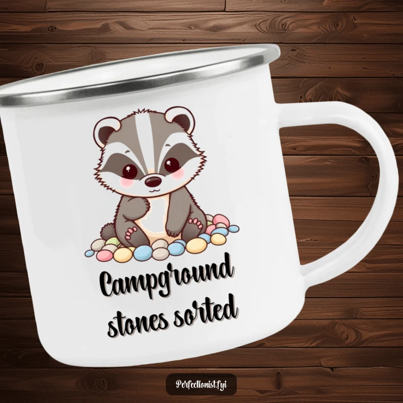 Funny badger camping mug showing a tidy badger character meticulously alphabetizing small pebbles, ideal for outdoor enthusiasts who appreciate orderly humor.