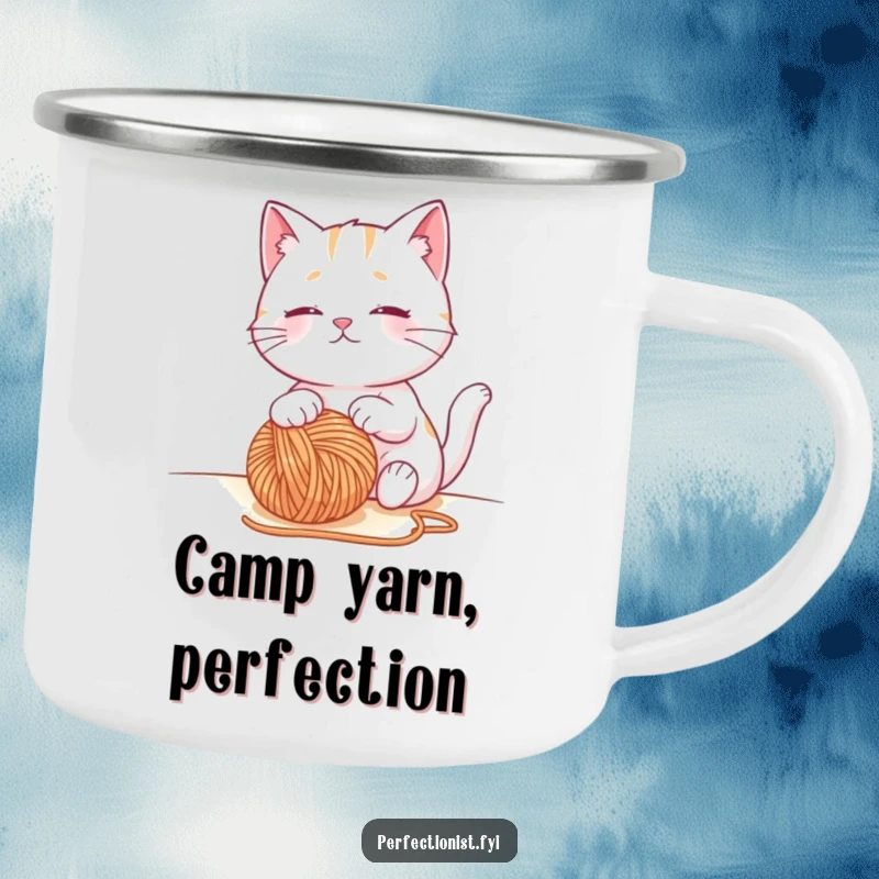 Funny cat camping mug with a contented cat character observing a perfectly placed ball of yarn, a durable and humorous outdoor cup.