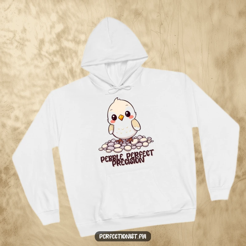 Funny hoodie showing a bird character meticulously arranging pebbles, perfect for expressing a love for organization and a good laugh.