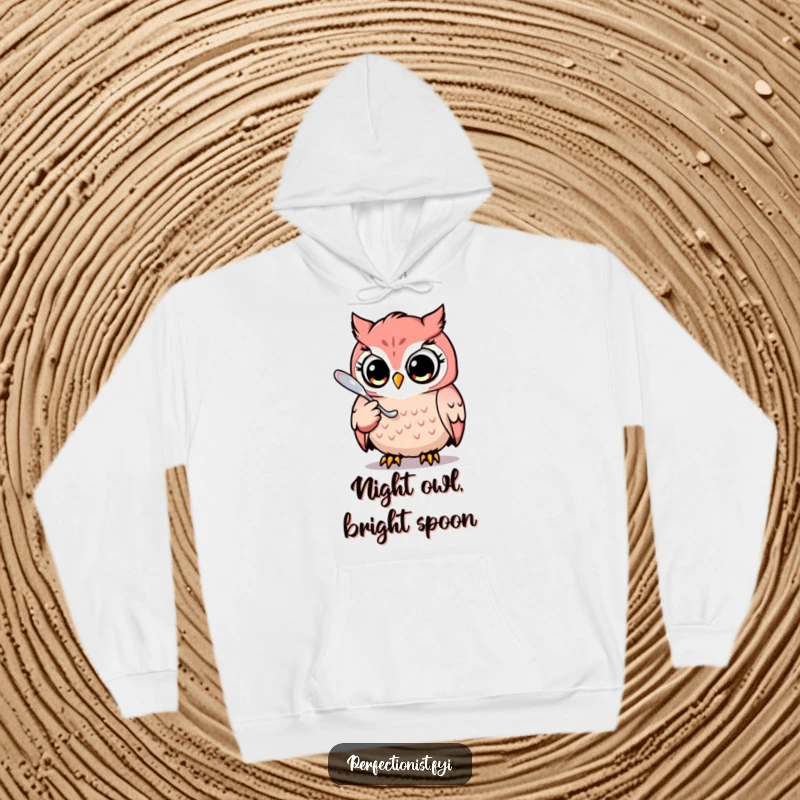 Funny hoodie featuring a focused owl character meticulously polishing a gleaming spoon, perfect for cozy nights and perfectionists.