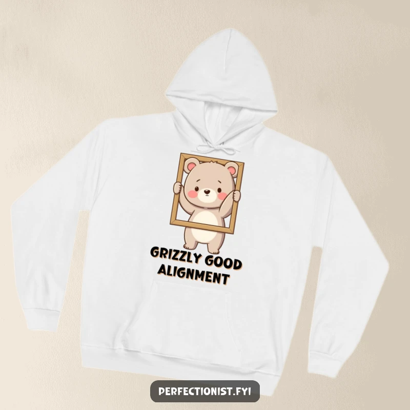 Funny Hoodie: A bear carefully straightens a picture frame, combining cozy comfort with humorous order.
