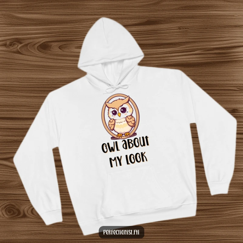 Funny cute owl meticulously arranging its feathers in a mirror on a cozy hoodie, perfect for chilly nights.