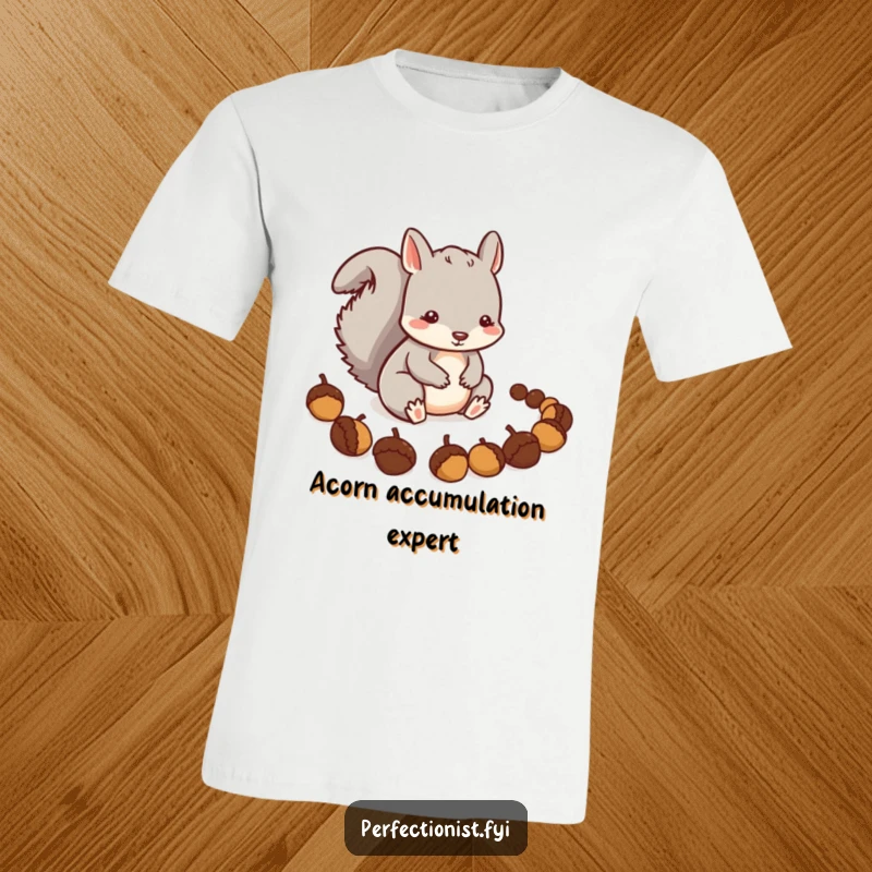 Funny Squirrel T-Shirt: A careful squirrel character is precisely arranging a line of acorns, representing meticulousness and resourcefulness.