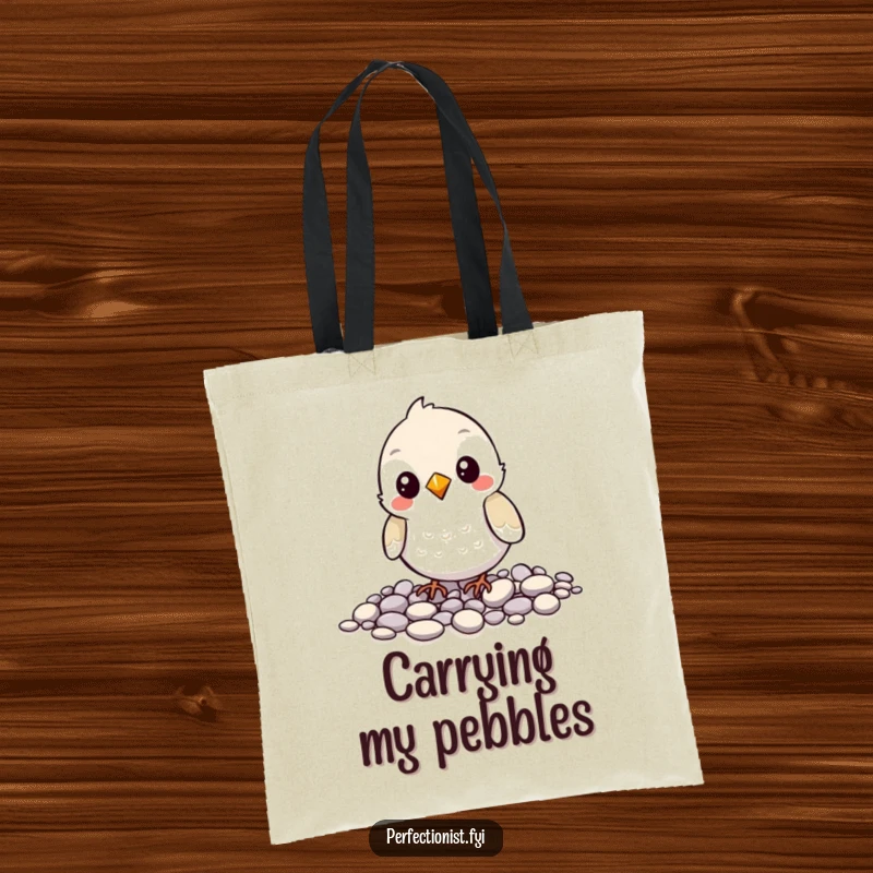 Funny tote bag with a bird character carefully aligning pebbles, showing off its orderly nature and a humorous love for small stones.