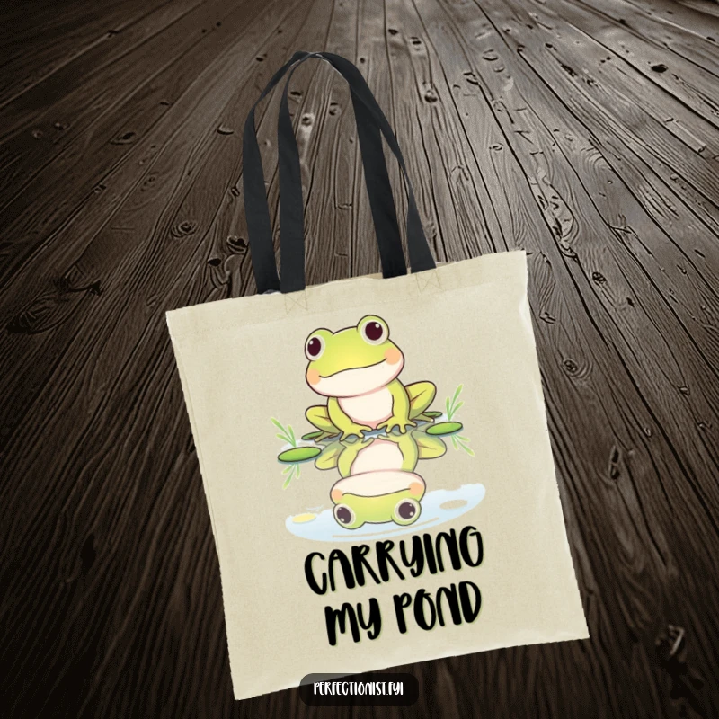 Funny tote bag with a frog character polishing its reflection in a still pond, highlighting its vain yet charming and humorous nature.