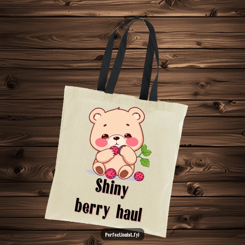 Funny Tote Bag: Focused bear character polishing a single berry to a shine, a humorous and practical accessory for the diligent.
