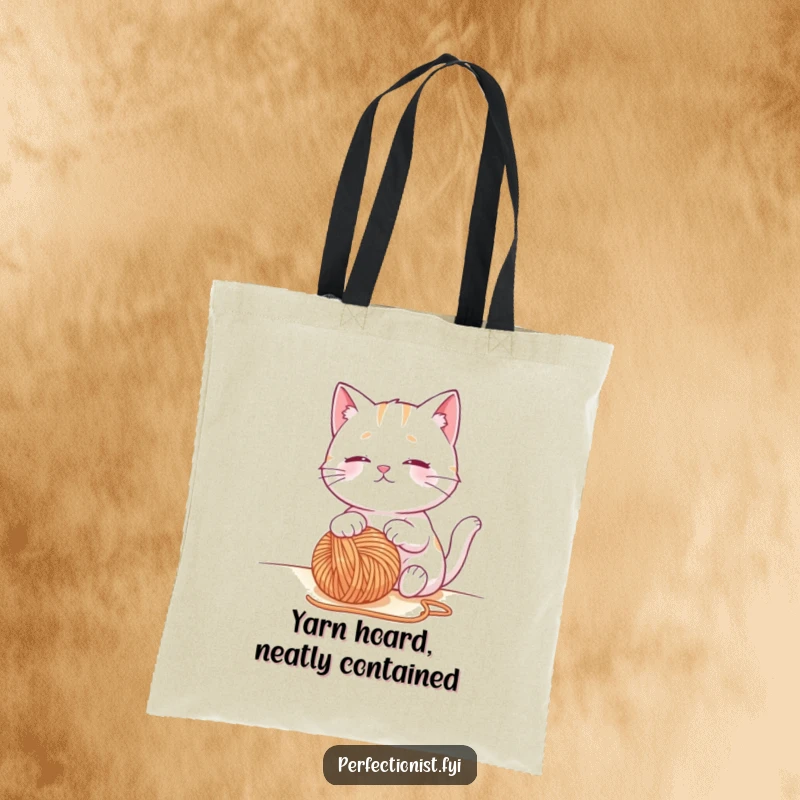 Funny cat tote bag depicting a contented cat character observing a perfectly placed ball of yarn, a humorous and practical gift.