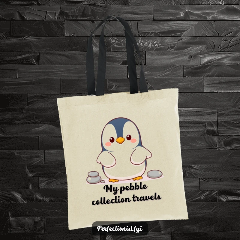 Funny penguin tote bag depicting a cheerful penguin character organizing pebbles in a line, a humorous and practical gift.